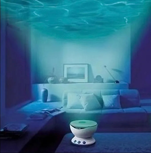 Blue coloured ocean-themed LED projection lamp on a surface for children's puzzle activities.
