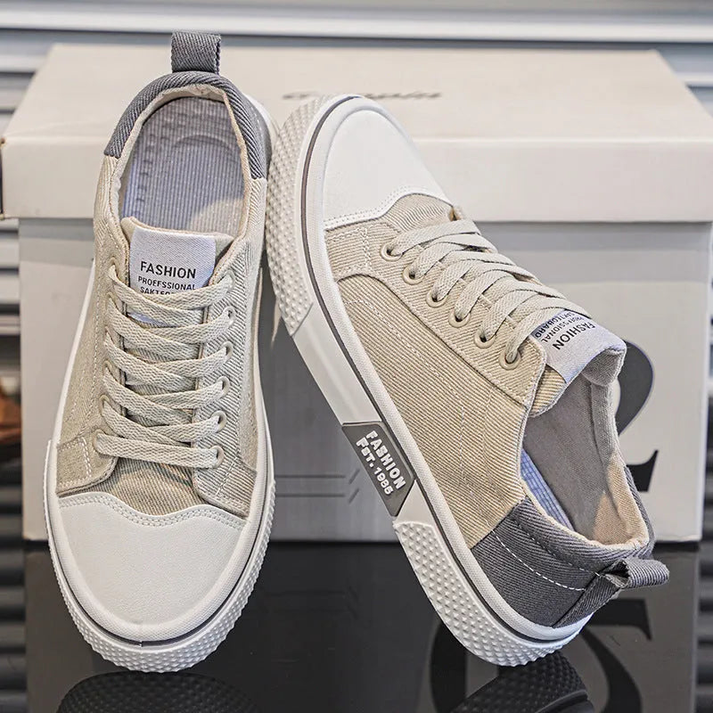 Men's low-top canvas skate shoes in blue with lace-up front and white PVC sole