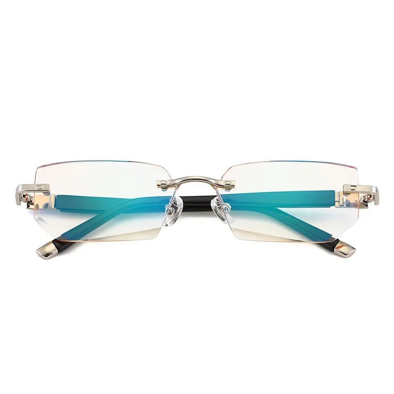 Diamond-cut metal reading glasses with tan frame and black lenses on a plain background