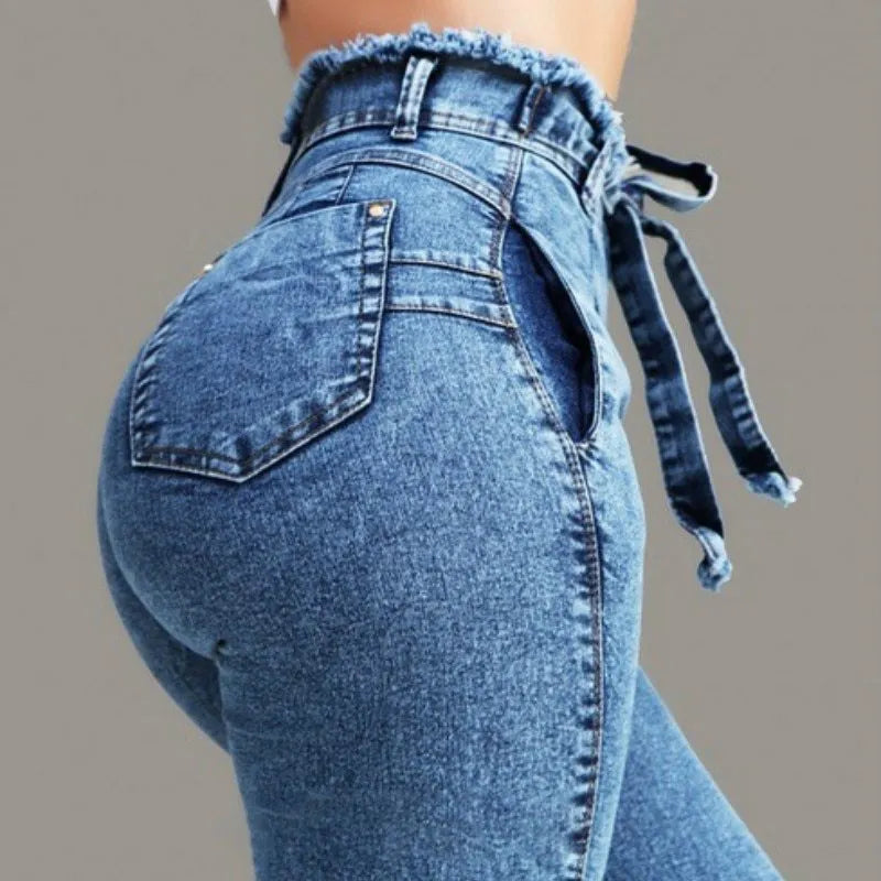 Women's fringed jeans with decorative frayed hems in dark blue, grey, and light blue colours
