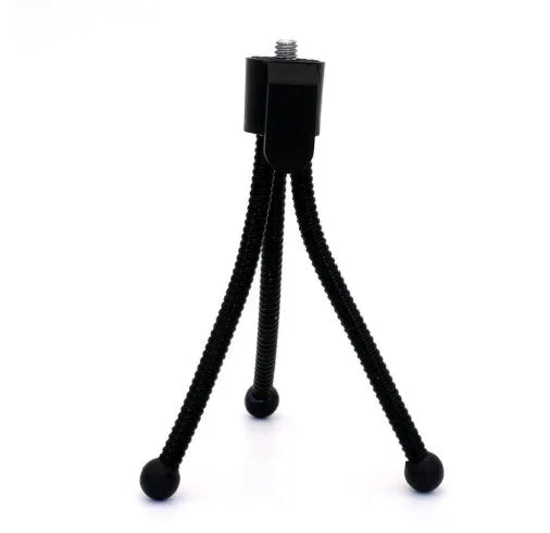 Compact aluminium mini tripod with ball head, shown contracted to 110mm height next to a smartphone.