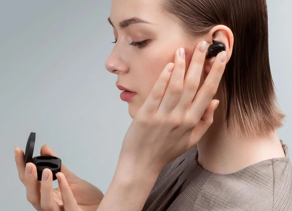 Redmi AirDots 2 black true wireless earbuds and charging case on a white background.
