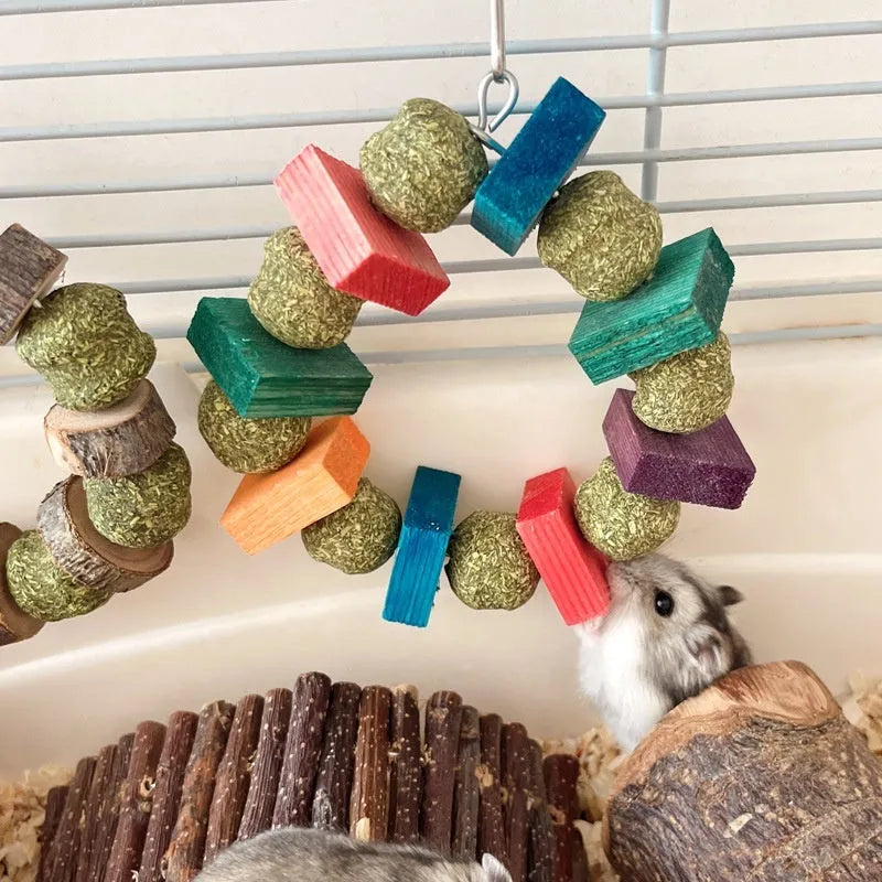 Hamster chew toy with two straw ball rings - one colourful sequin design, one natural applewood