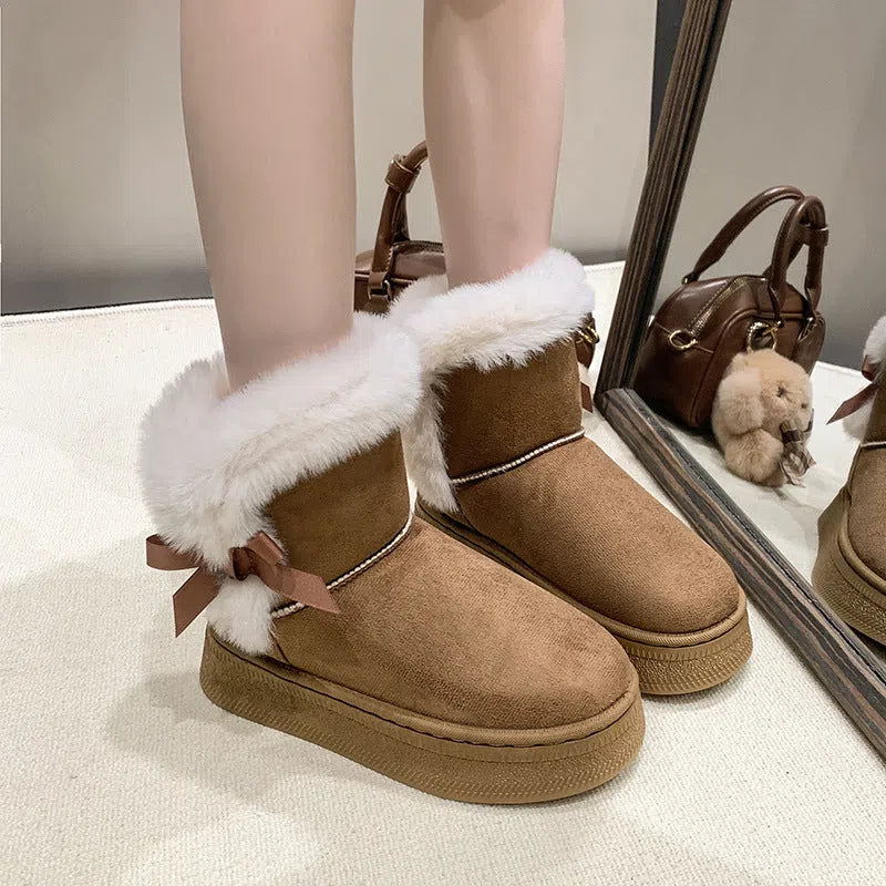 Women's mid-calf suede snow boots with faux fur lining, 1–3 cm thick rubber sole, and bow tie detail, shown in brown, black, or white.