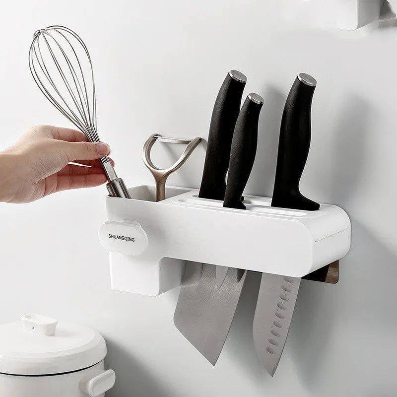 White plastic freestanding kitchen knife rack on a countertop.
