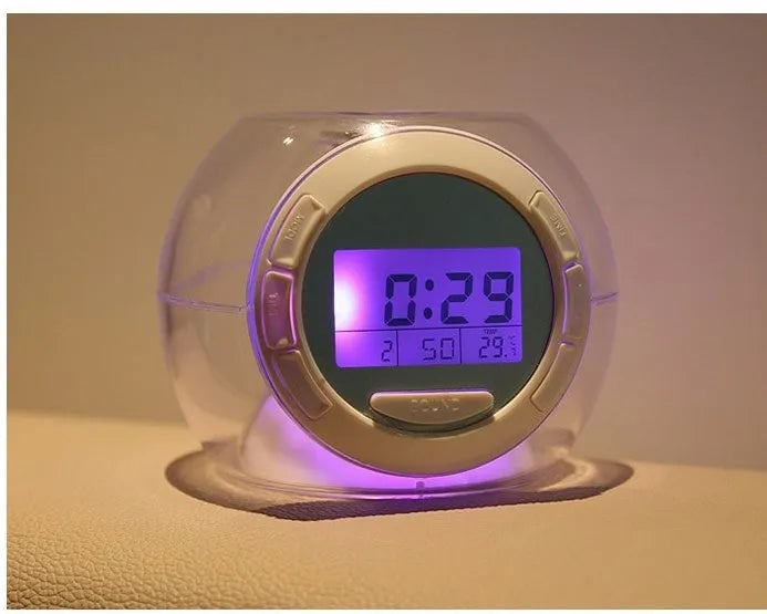 White colourful natural sound alarm clock with large LCD display showing time and temperature, featuring 6 nature sounds and 7 colour cycle night light