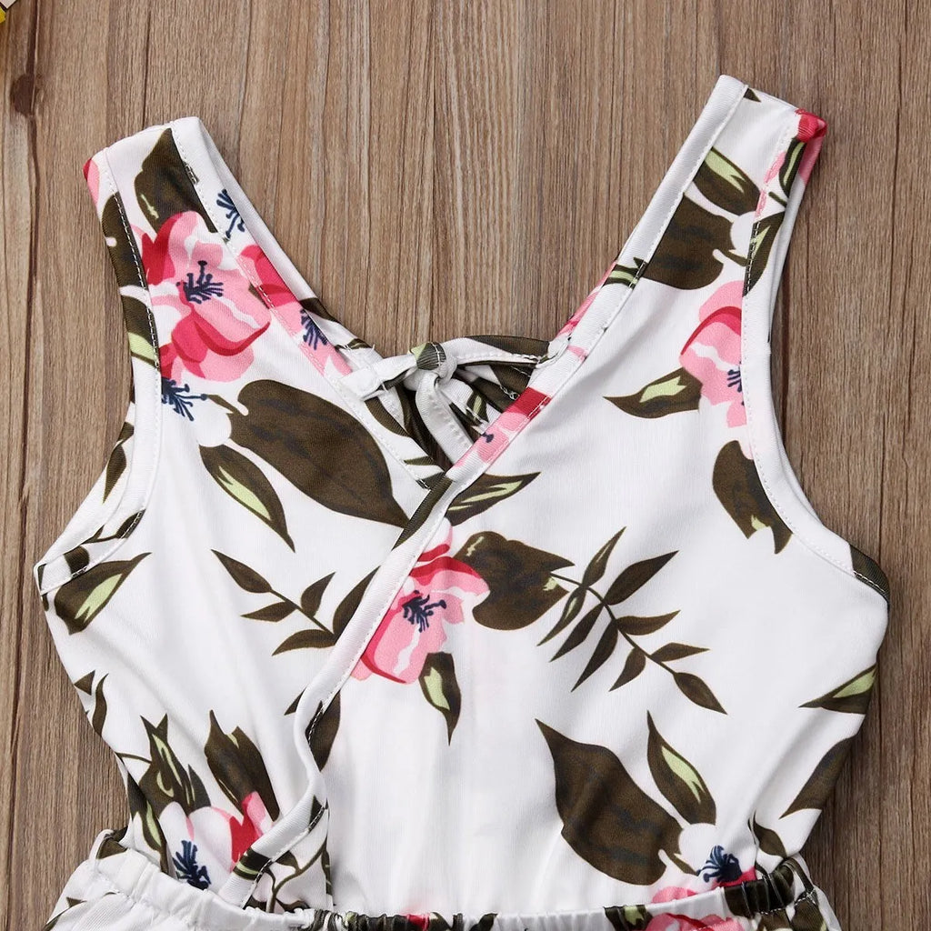 White and yellow floral print cotton outfit for a baby girl, showing Asian sizing from 90cm to 130cm.