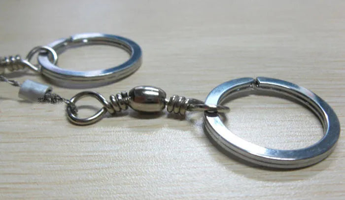 Stainless steel survival wire saw with pull rings, 55cm blade, total length 70cm.