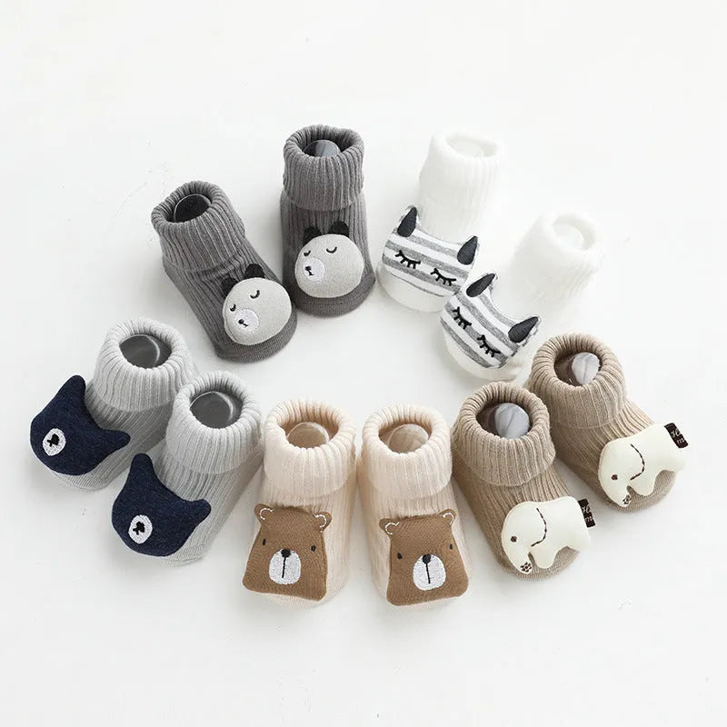 Children's combed cotton non-slip socks in multiple colours for sizes XS, S, and M.
