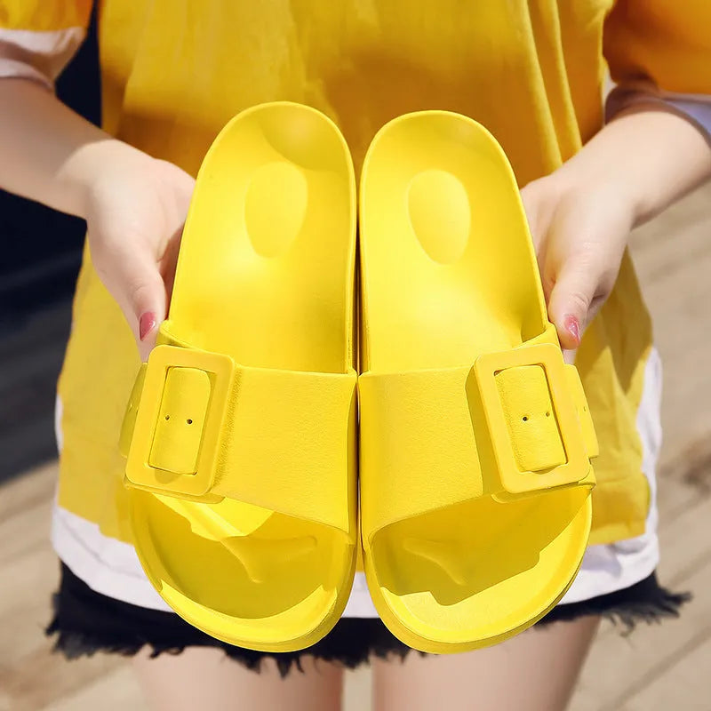 Women's grey blue flip-flop slippers with a soft EVA sole and a silver single buckle.