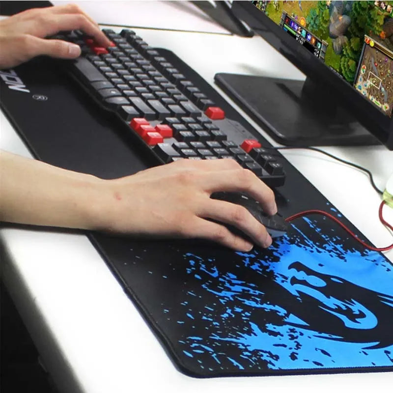 Non-slip mouse pad with textured surface and reinforced stitched edges on a desk