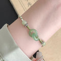 Green jade buckle women's bracelet with double ring design and copper construction