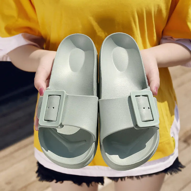 Women's grey blue flip-flop slippers with a soft EVA sole and a silver single buckle.