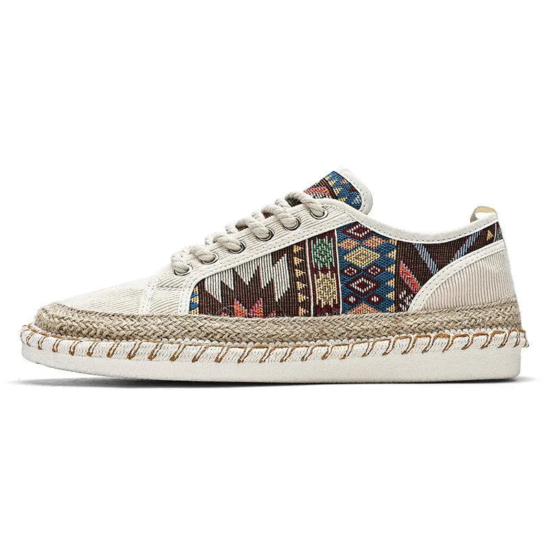 Men's beige and black cloth casual shoes with round toe, shown from the side.