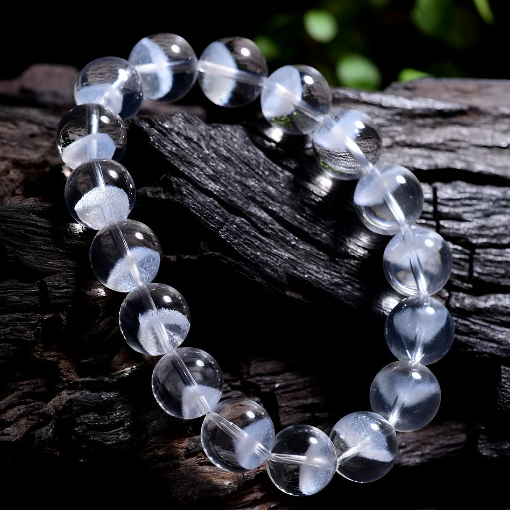 Women's white crystal bracelet with natural ghost pyramid shapes and Ruyi design elements