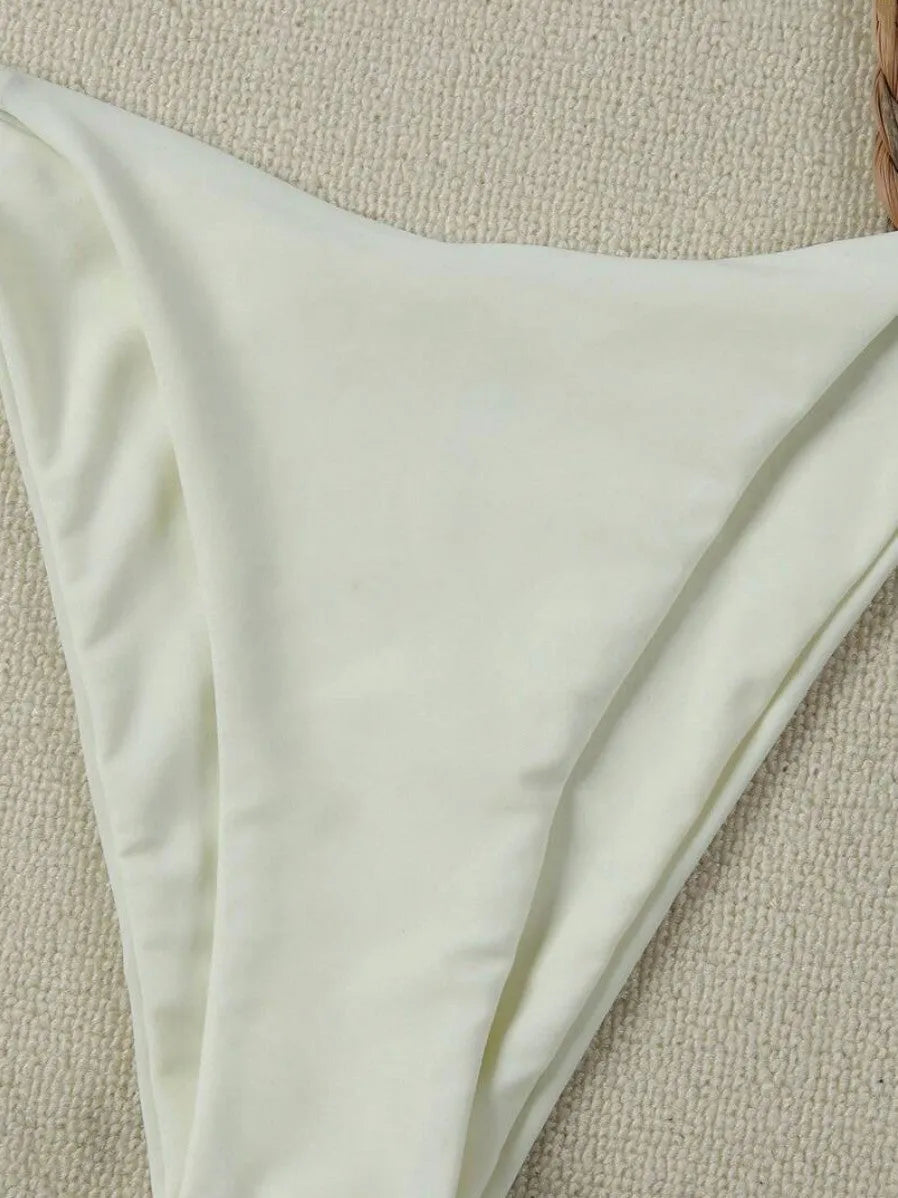 Milky white women's pure colour nylon bikini set with briefs style bottom on display
