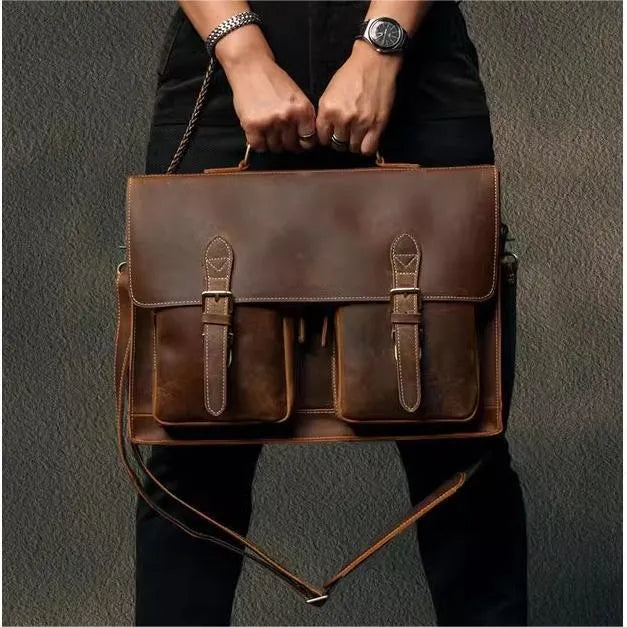 Genuine cowhide leather crossbody computer bag in solid colour with visible sewing lines