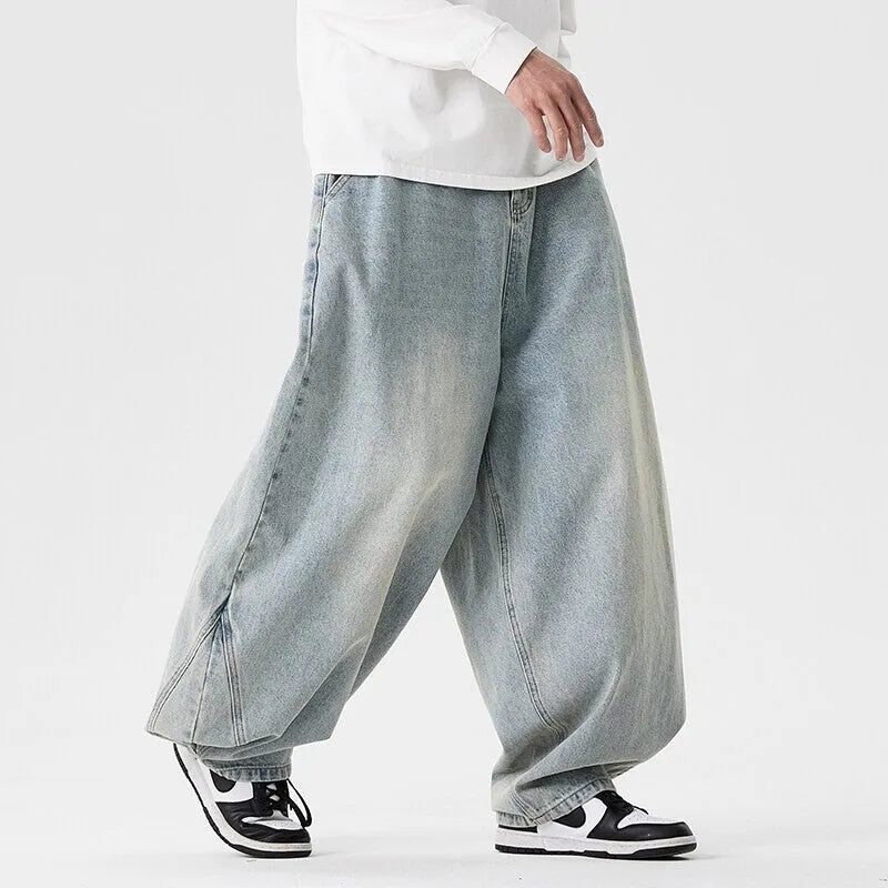 Men's plus size light blue wide leg baggy jeans on a hanger