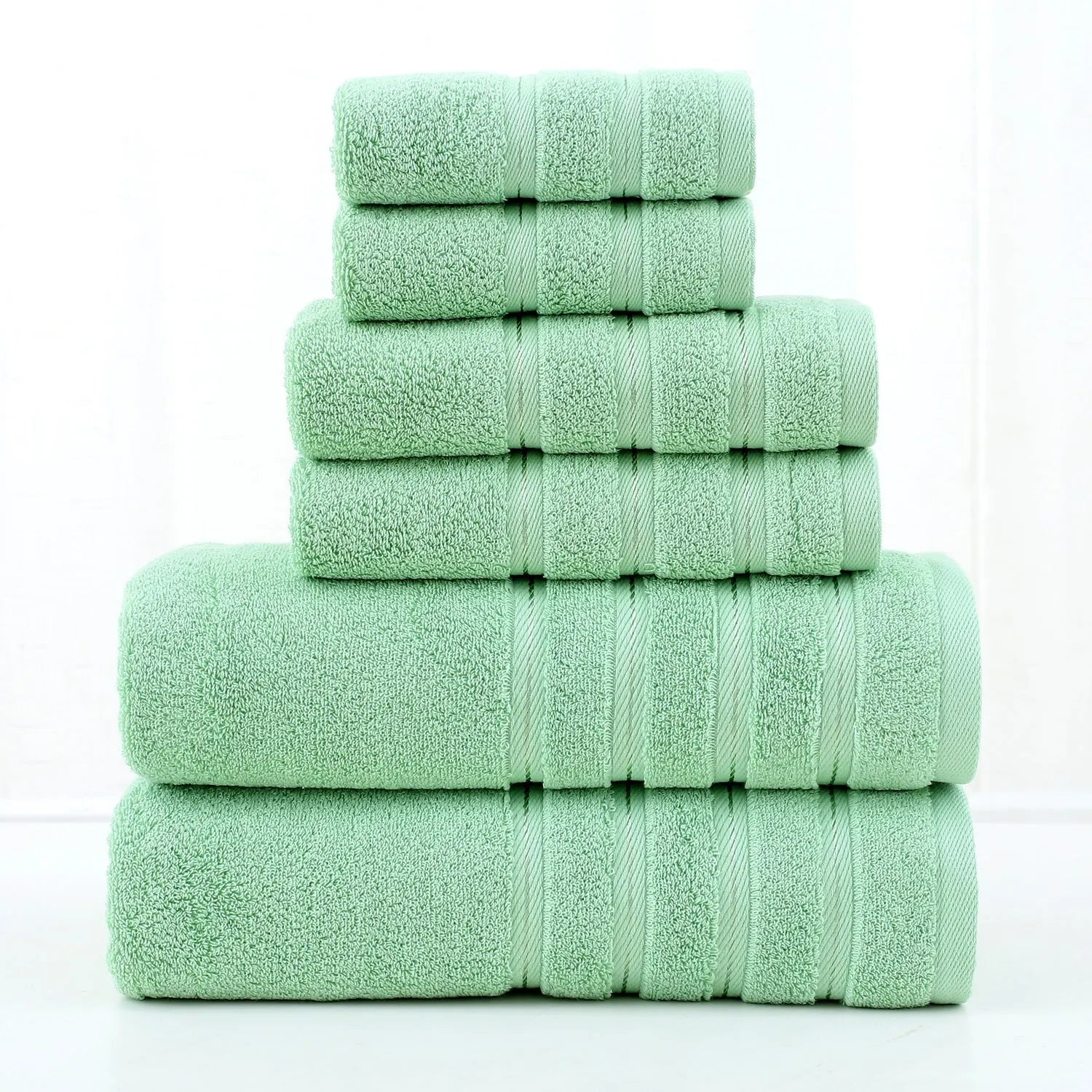 Six-piece combed cotton towel set in twill weave with bath towel, hand towel, and square towel in matching colour