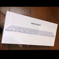White ultra-thin metal Bluetooth wireless keyboard with multimedia function keys for Apple devices