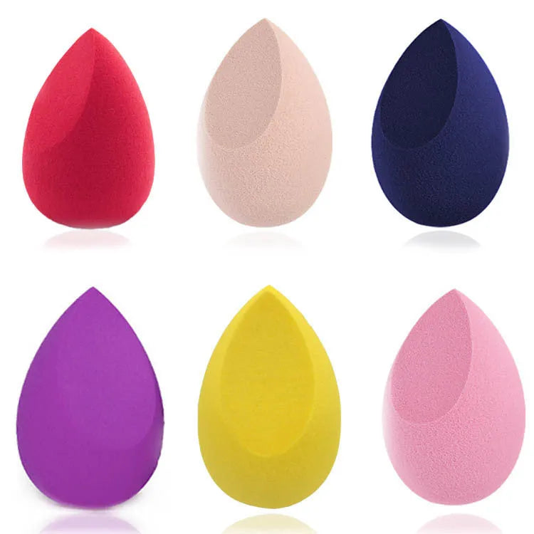 Set of 10 nude, pink and rose red hydrophilic non-latex makeup sponges in bevel drop and peach heart shapes.