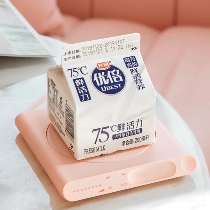 Pink and white USB-powered mechanical heating coaster for coffee mugs and teacups
