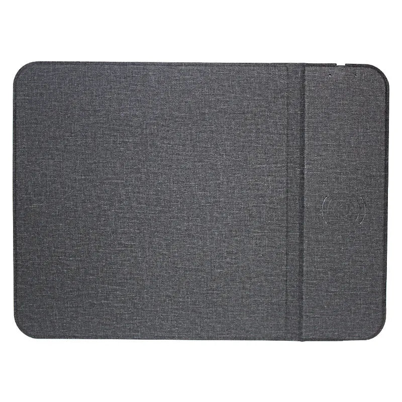 Grey foldable cloth phone holder open in stand mode, wirelessly charging a smartphone.