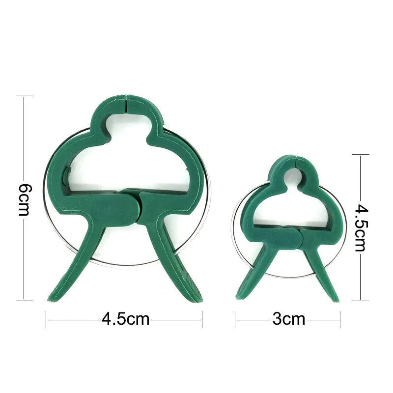 Green plastic and zinc plant fixing clips for tomatoes and climbing vines, showing large and small sizes