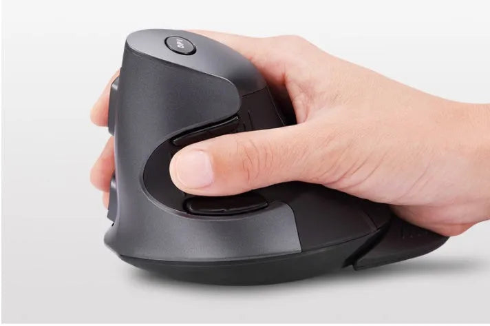 Black wireless vertical ergonomic mouse on a desk, showing its upright design and DPI switch.