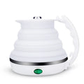 Foldable electric kettle 555ml in blue silicone collapsed on table with push button and short power cord