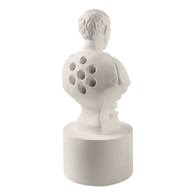 White synthetic resin American creative character model pen holder on a desk.