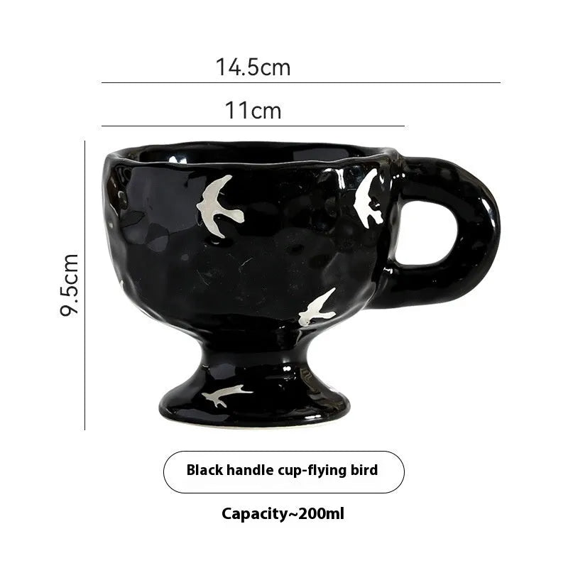 Hand-pinched irregular ceramic mug in a solid colour, showing its unique shape.