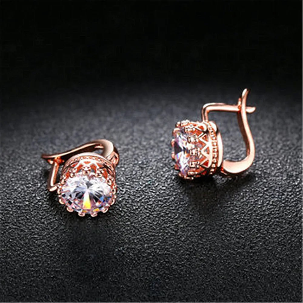 Korean retro crown-shaped ear clip earrings in rose gold or white gold colour with white diamond details.