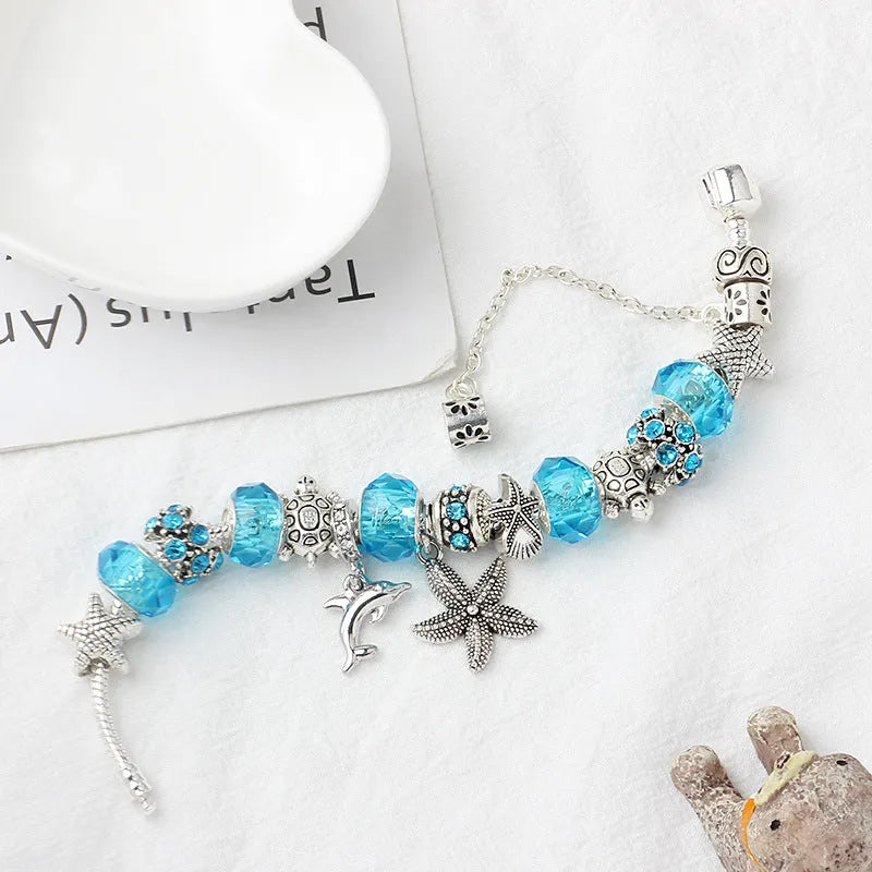 Blue Ocean alloy beaded bracelet with dolphin and starfish pendant, electroplated finish, 18 cm length option