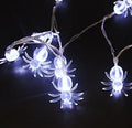 Halloween LED string lights with plastic pumpkin, ghost and bat decorations hanging on a 1.2 metre cable.
