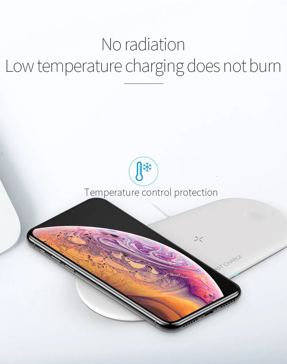 Black and white three-in-one wireless charging station for Apple iPhone, iWatch and headphones on a desk.