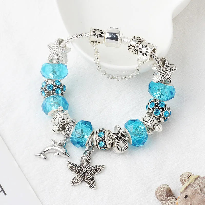Blue Ocean alloy beaded bracelet with dolphin and starfish pendant, electroplated finish, 18 cm length option
