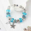Blue Ocean alloy beaded bracelet with dolphin and starfish pendant, electroplated finish, 18 cm length option