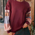 Women's loose fit long-sleeved top with plaid stitching in apricot colour.