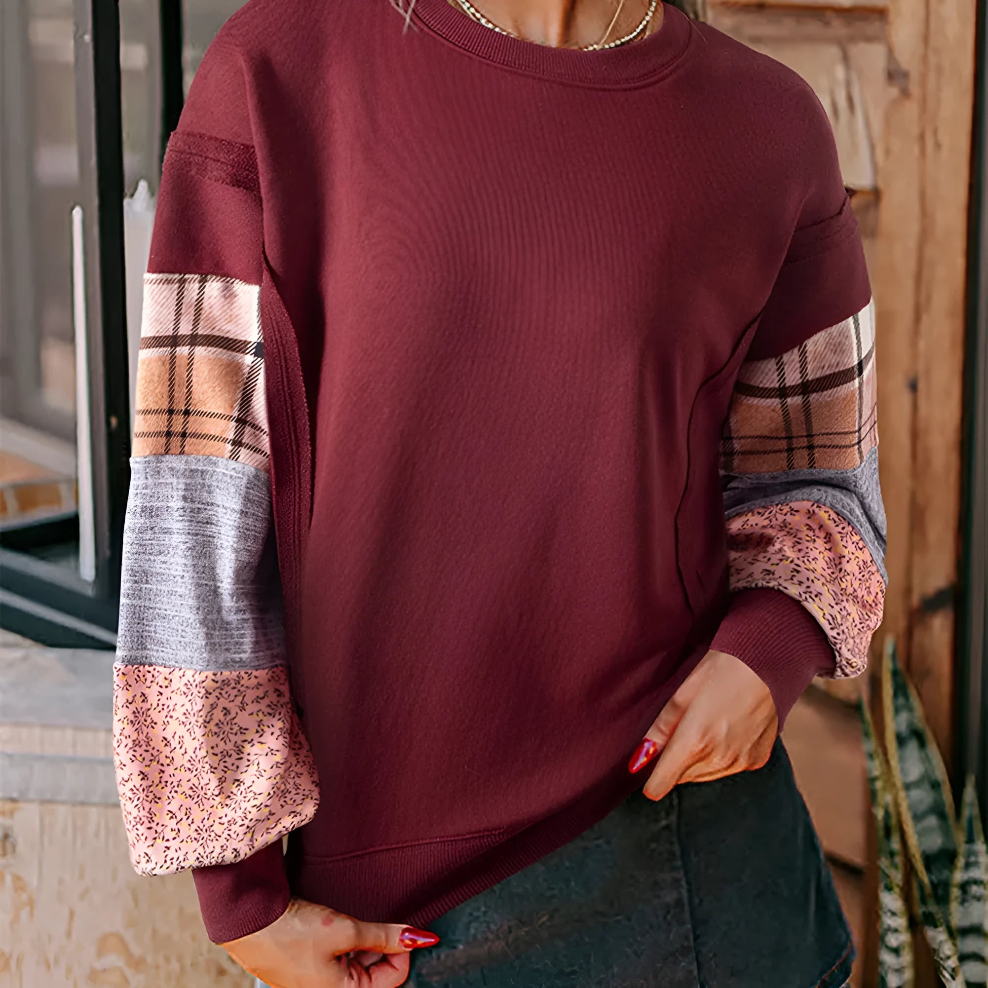 Women's loose fit long-sleeved top with plaid stitching in apricot colour.