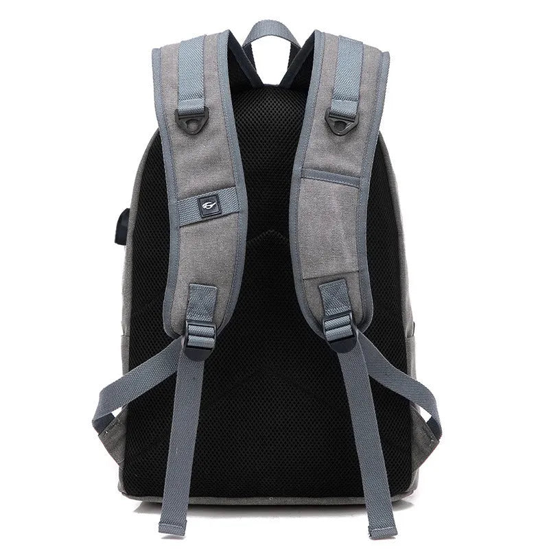Canvas backpack with USB charging port and laptop compartment in grey colour