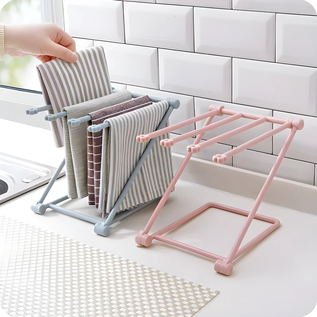 Foldable plastic dishcloth shelf organiser in light blue mounted on wall