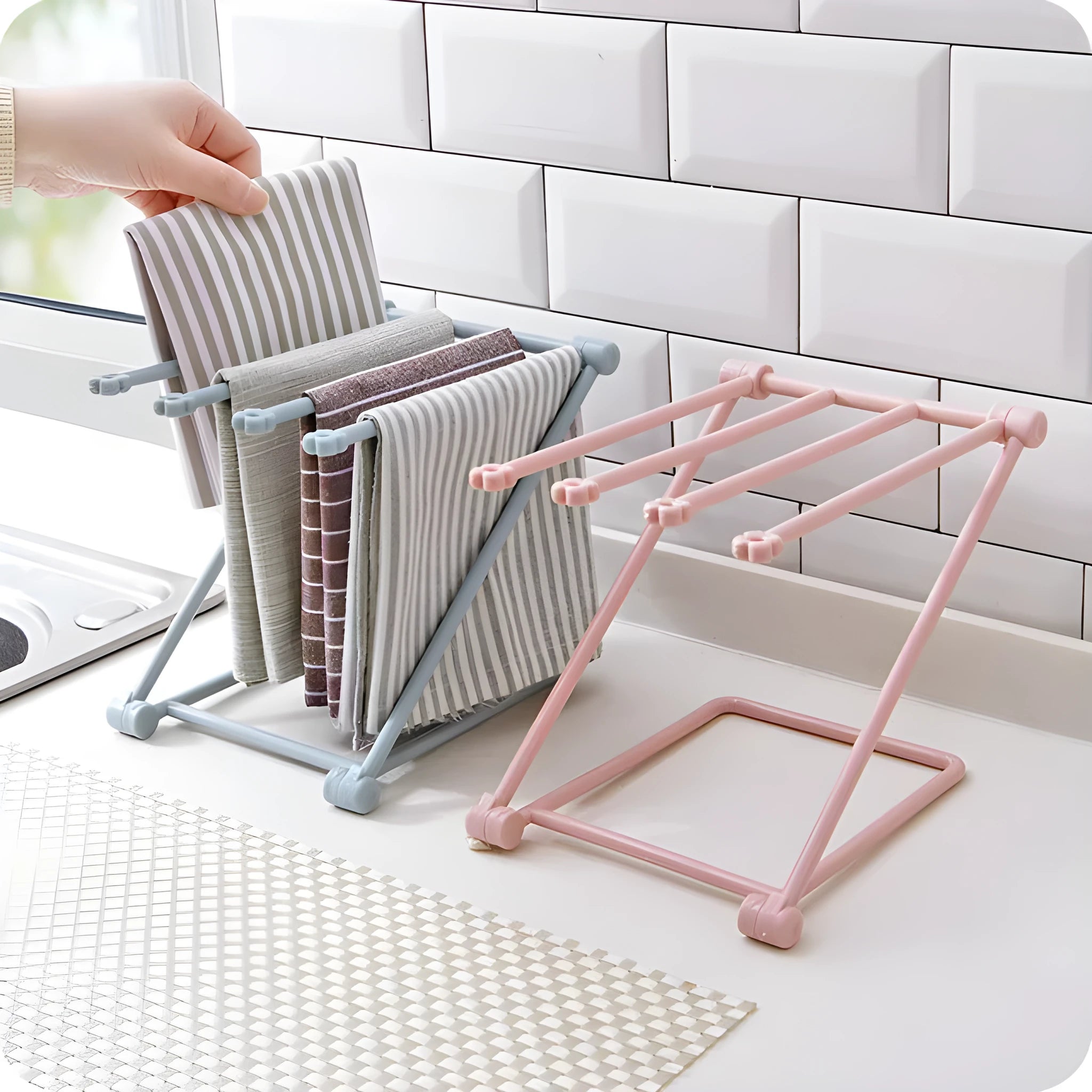 Foldable plastic dishcloth shelf organiser in light blue mounted on wall