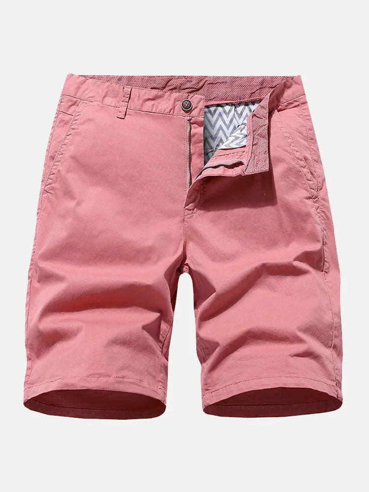 Man wearing loose-fitting blue denim casual shorts with a straight leg cut.