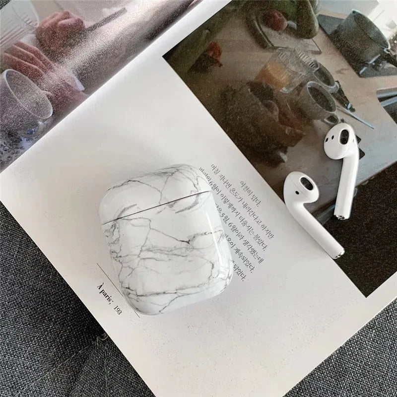 White marble pattern hard protective case for AirPods 1 and 2 wireless headphones charging box.