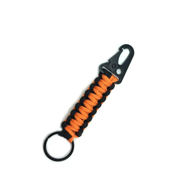 Seven-core parachute cord keychain with metal clasp in black, army green, and orange colours.