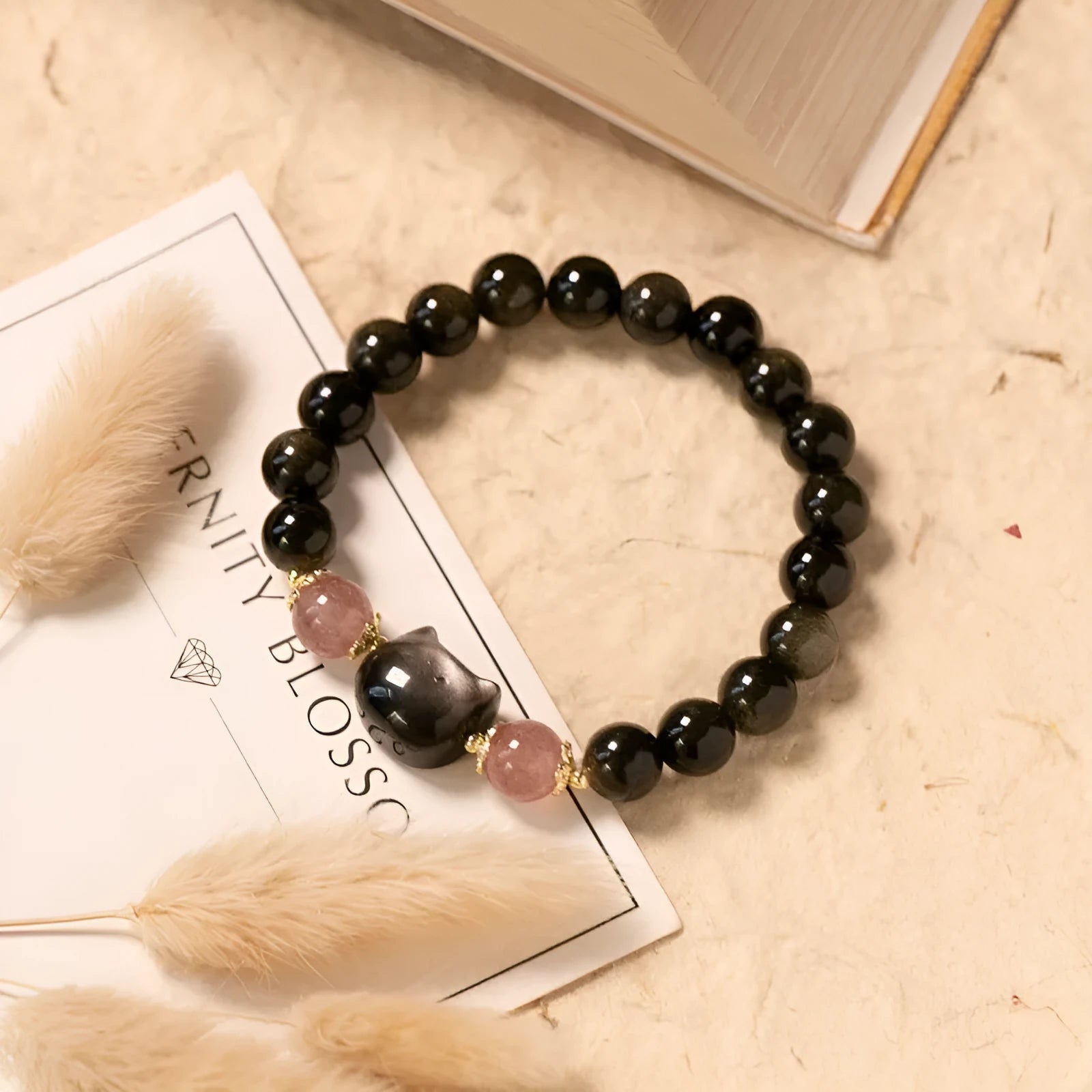 Black natural obsidian stone bead bracelet with silver kitty charm and sliding knot adjustment