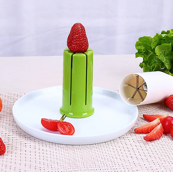 White ABS plastic vegetable slicer with stainless steel blades for cucumbers, carrots, and strawberries