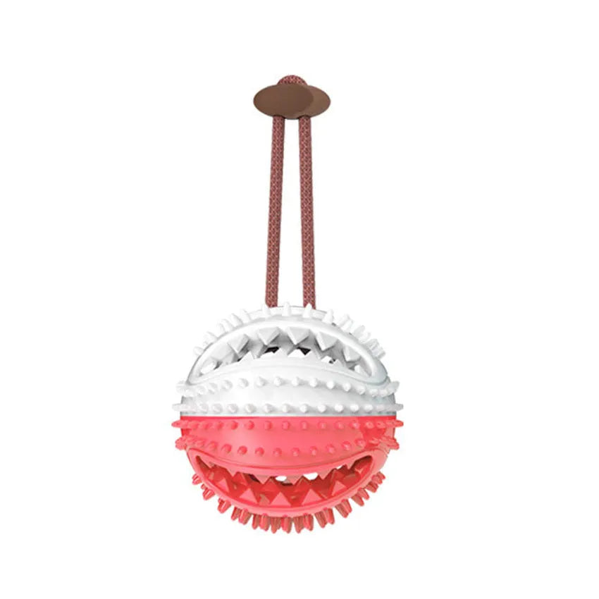 Silicone suction cup dog tug ball in red and blue for chew, tooth cleaning, and interactive play