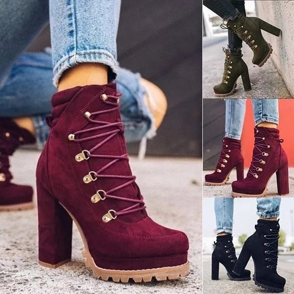 Women's suede high heel Roman ankle boots with round toe, thick heel, and buckle detail in four colours.
